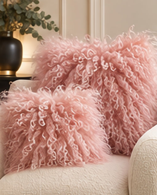 Blush Pink Mongolian fur cushions, 45cm and 60cm, on a cream boucle sofa - handmade curly lamb fur cushions [shade: Blush Pink]
