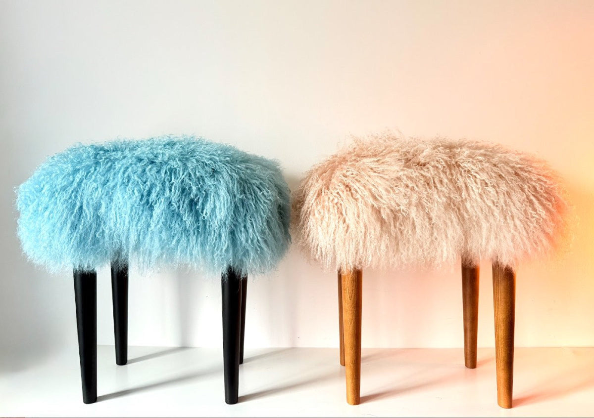 Pair of handmade Mongolian fur rectangle stools in duck egg blue and blush pink on black and natural wood legs