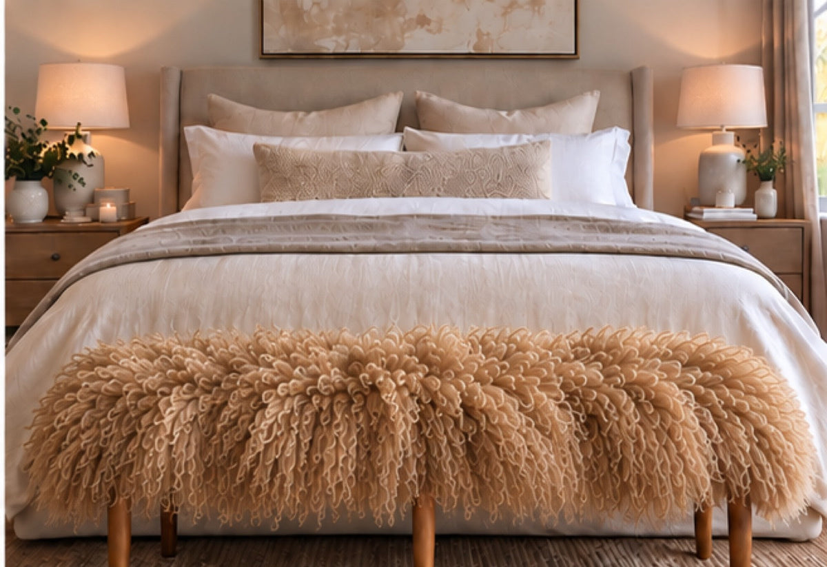 Handmade sandstorm Mongolian fur tapered leg bench at the end of a queen bed