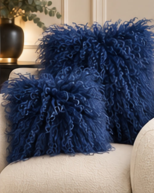 Cobalt Blue Mongolian fur cushions, 45cm and 60cm, on a cream boucle sofa - handmade curly lamb fur cushions [shade: Cobalt Blue]
