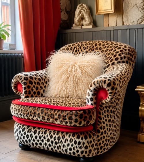 Cream Mongolian fur cushion, 45cm, on a leopard print armchair - handmade fluffy cream curly lamb fur cushion [main] [shade: Cream]