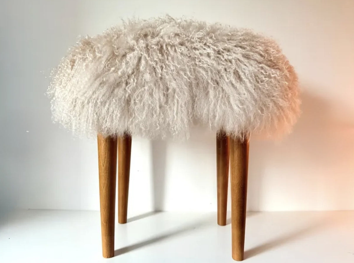 Handmade oyster Mongolian fur rectangle stool on sand oak tapered legs, front view