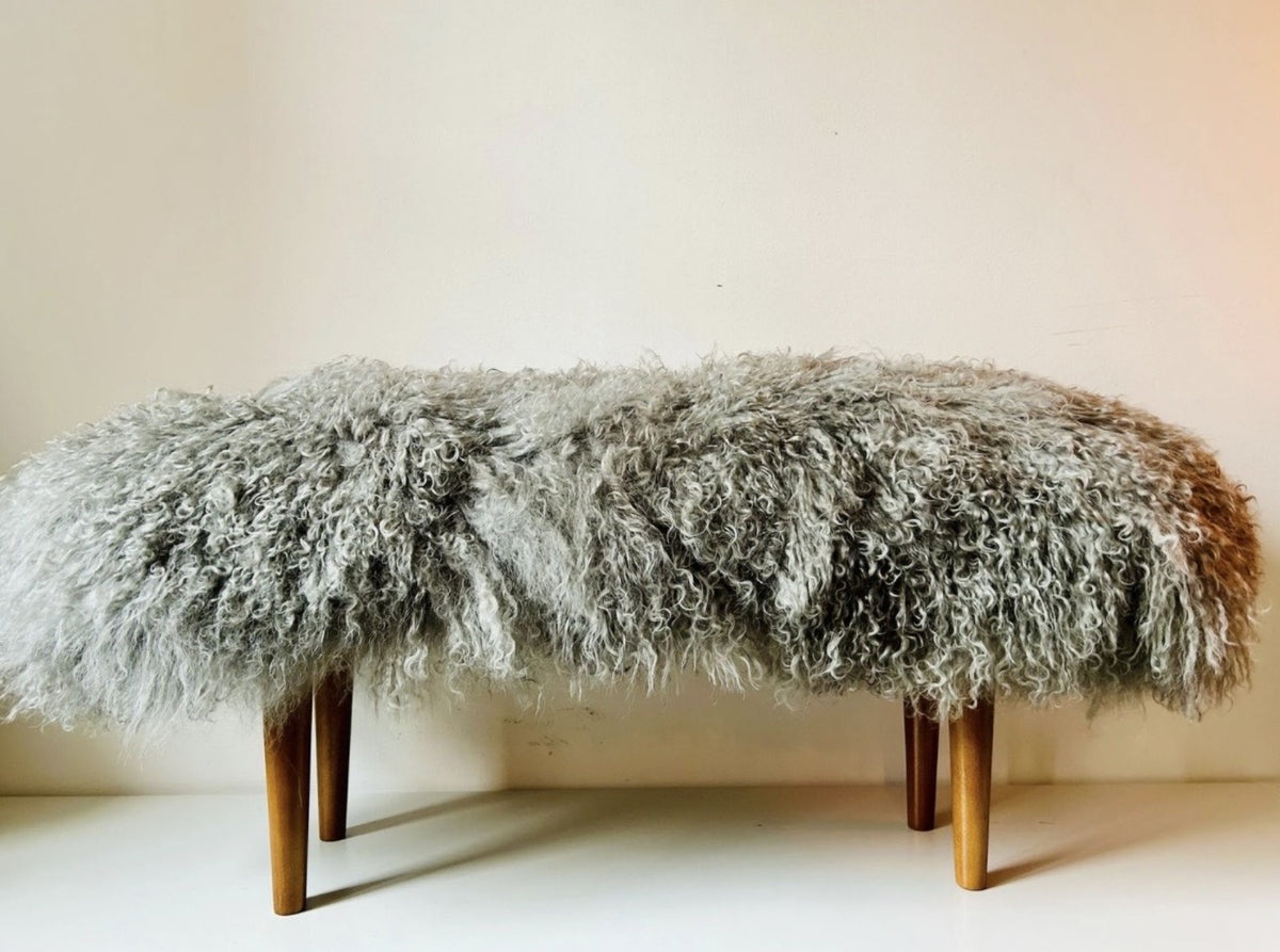 Handmade grey Mongolian fur single bench on 12 inch sand oak tapered legs, photographed in our London studio