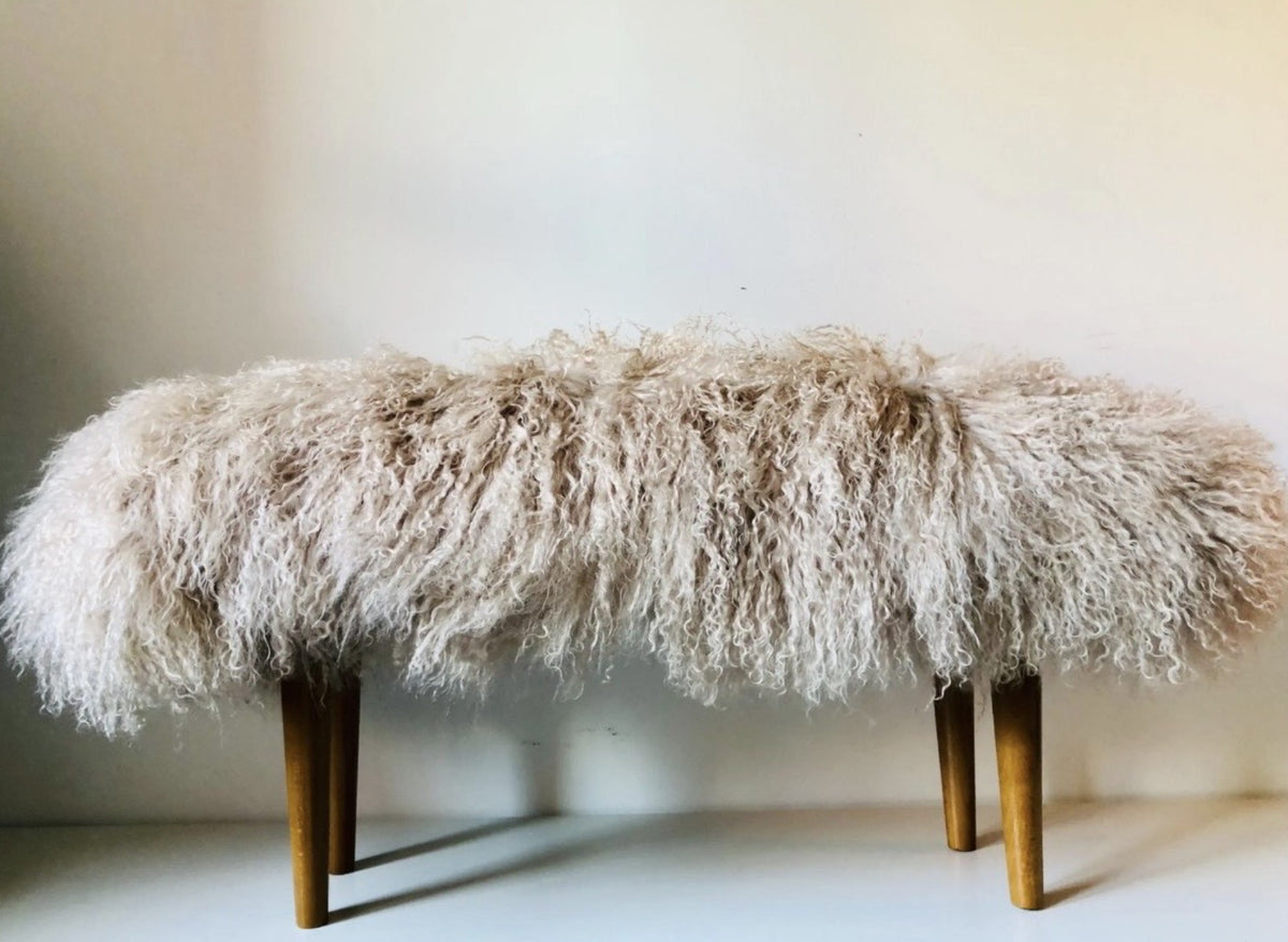 Handmade oyster Mongolian fur single bench on 12 inch sand oak tapered legs, photographed in our London studio